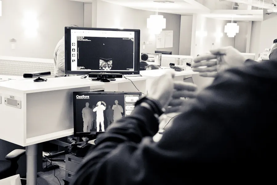 Gesture control being tested at a desk with two Kinect sensors and depth video on screen