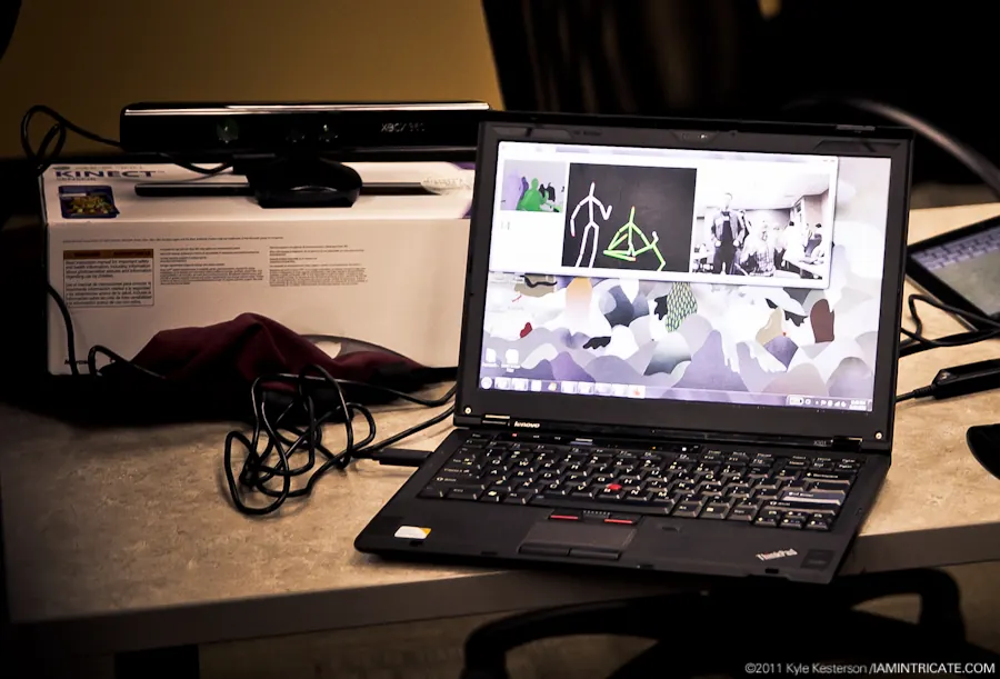 A Kinect sensor beside a laptop running the flat-puppet animation tool